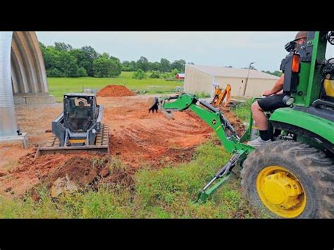 Cutting Grade with the Skid Steer and Digging Out a Hill Side